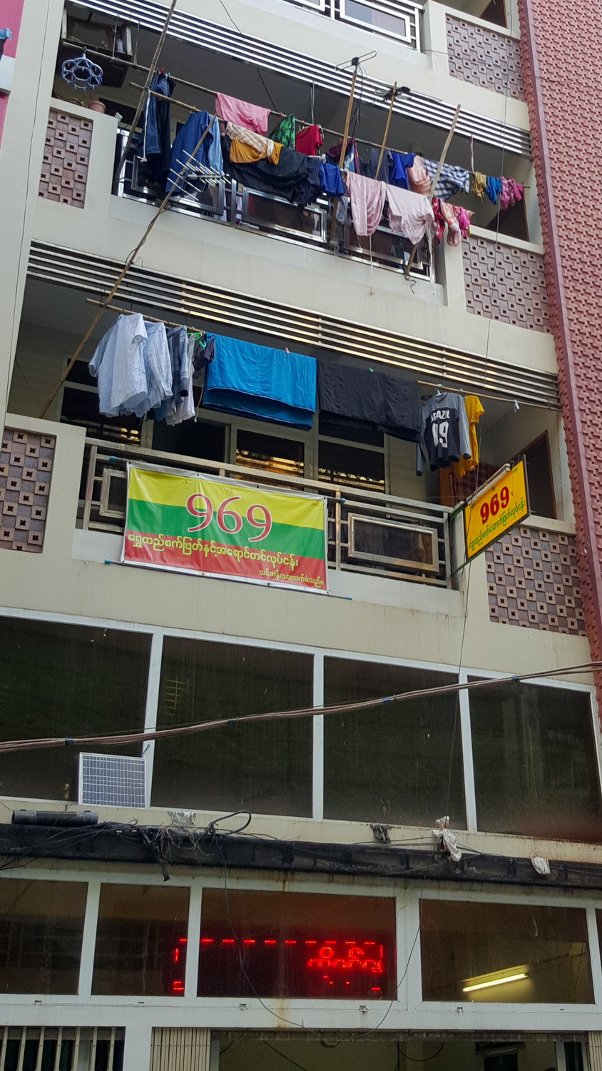 And just down from the mosque, a 969 flag on someone's balcony (969 are the local violently anti-islamic group).
