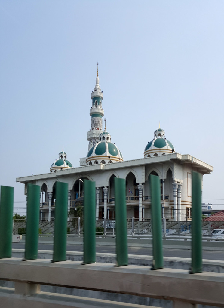Nicely colour-coordinated highway divider poles and mosque (obviously deliberate).