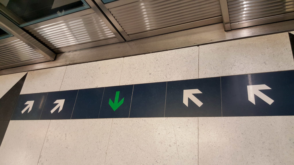 These wonderful arrows on the platform line up with the train doors. And people actually obey them, making simultaneous ingress and egress possible. Truly a wonderful sight.